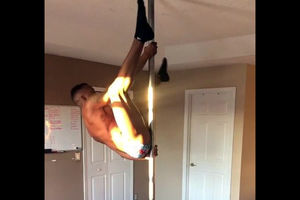 Dark-hued male stripper flipping on a..